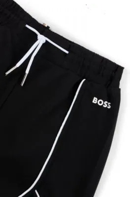 Kids' shorts in stretch fabric with piping and logo