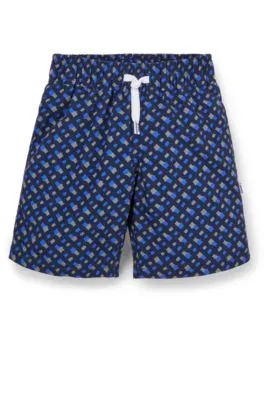 Kids' swim shorts with monogram print