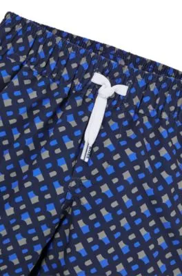 Kids' swim shorts with monogram print