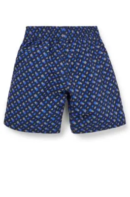 Kids' swim shorts with monogram print